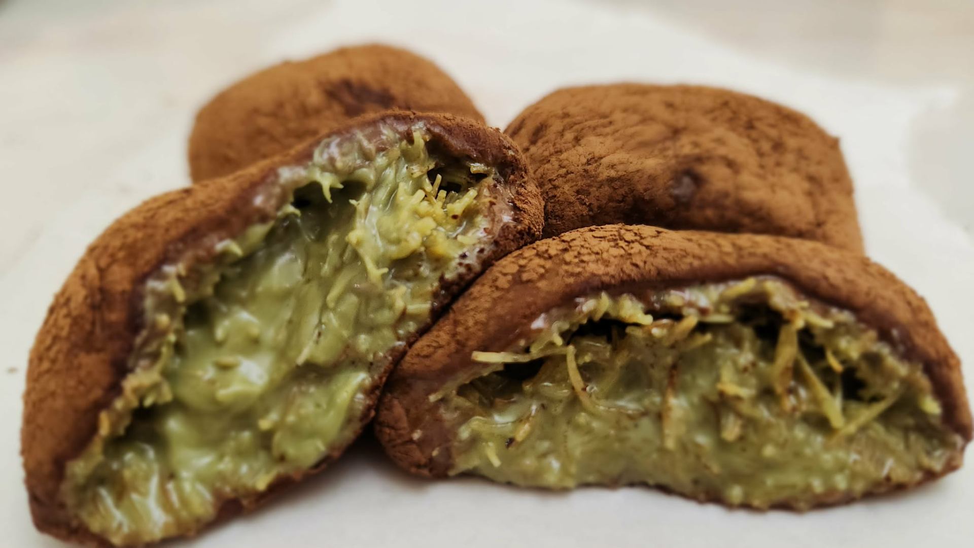 Stack of pistachio Dubai chewy cookies with knafeh